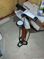 Full view of floor pump showing barrel, gauge, handle and base