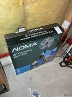 Front view of sealed NOMA 16" Oscillating Stand Fan box