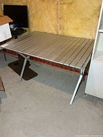 Assembled aluminum table showing full structure