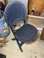 Resin folding deck chair unfolded front view