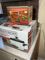 Both boxed items stacked, showing brand names and product images