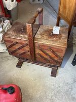 Closed oak sewing stand showing exterior condition