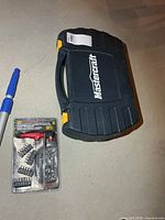 Closed Mastercraft case beside packaged driver bit set