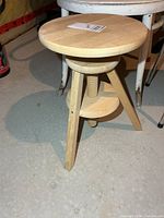 Full view of wooden adjustable stool