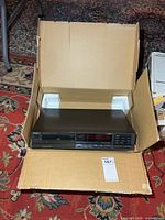 CD player inside original cardboard box with foam supports