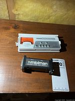 Top view of Boss tuner and Midiman MIDI module together