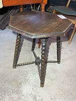 Full view of octagon side table showing legs and stretcher