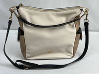 Front view of Coach Harley colorblock hobo bag showing color arrangement and logo