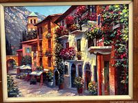 Close view of artwork showing village street scene