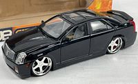 Front/side view of black Cadillac CTS die-cast model