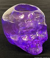 Front angled view of purple crystal skull votive holder