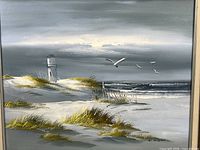 close view of painting showing lighthouse, dunes, seagulls