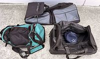 All three bags displayed on concrete surface