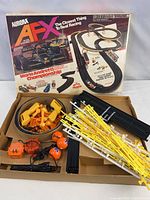 Box lid showing Aurora AFX Mario Andretti Championship artwork and contents displayed