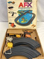 overall lot in box with track, controller, transformers, and box lid