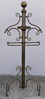 Full view of brass valet stand showing height and overall form