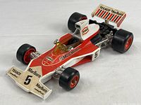 Full view of Corgi McLaren M23B car showing livery and form