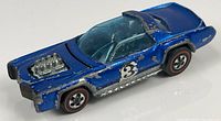 Right side view of blue Sugar Caddy showing paint wear, redline wheels, exposed engine