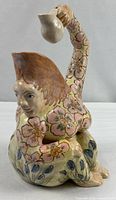 Front view of anthropomorphic floral pitcher