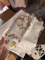 White cotton panel with woodland animal and floral motif