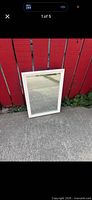 Front view of cabinet closed showing mirror door