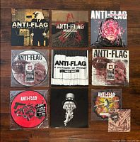 Grid of nine Anti-Flag vinyl records showing sleeves and picture discs