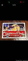 Front of Christmas-Opoly box showing title and artwork