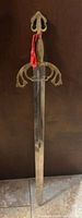 Full view of decorative sword showing overall design and length