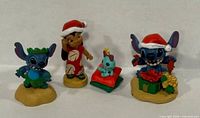 Front view of all four holiday figurines