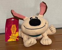 Front view of plush showing face, ears, hang tag