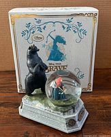 Front view showing snow globe, bear figure, base, original box