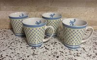 Set of four identical stoneware Mickey Mouse mugs