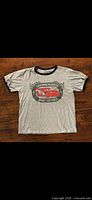 Full view of T-shirt front showing graphic and ringer style