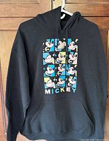 Front view showing Mickey Mouse nine-panel graphic and kangaroo pocket
