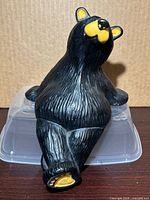 Front view of seated black bear figurine