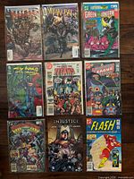 Group shot of eight bagged and loose single issues laid out