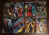 Eight Twilight Zone comic books laid out in two rows