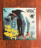 Front sleeve with multiple signatures and artwork