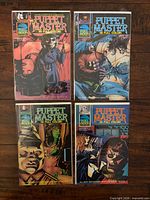 All four bagged Puppet Master comics, Issues 1-4, front covers visible