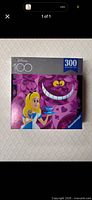 Front of sealed Ravensburger 300-piece Disney 100 Cheshire Cat puzzle box
