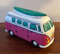 Front angled view showing surfboard roof, coin slot, hand-painted details