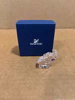 Figurine in front of Swarovski box