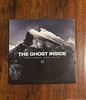 Front cover showing mountain artwork and album title