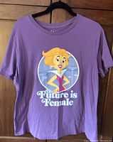 Full front view of purple Jetsons graphic T-shirt on hanger
