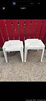 Both white plastic resin tables side by side showing tops and legs