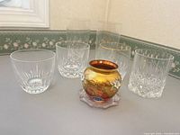 Amber art glass vase with enamel flowers and six crystal glasses