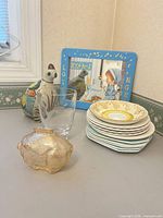 Group showing quail figurine, vase, pig bank, plate stack, mirror coat hanger