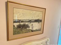 Full view of framed art print on wall
