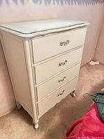 Full dresser front and side view showing four drawers and leg style