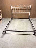Full view of headboard attached to metal frame showing overall structure